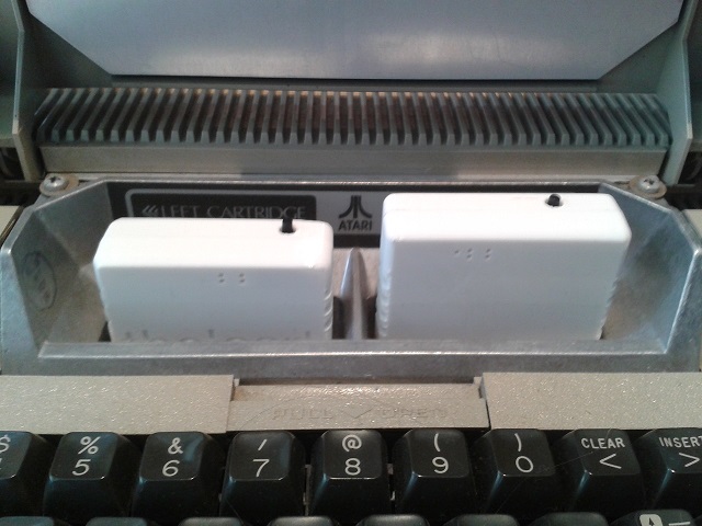 The!Cart V2 shell and V1 shell in an Atari 800 with lid opened